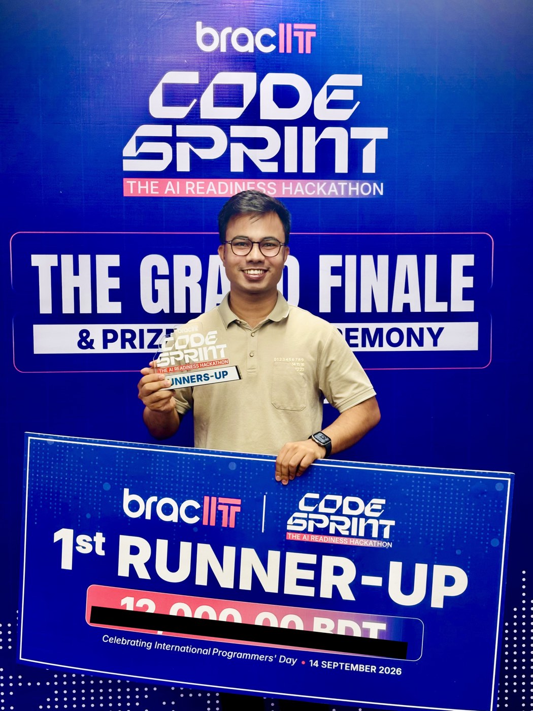 Mubin holding the 1st Runner-Up trophy at the BRAC IT Code Sprint 2026 grand finale